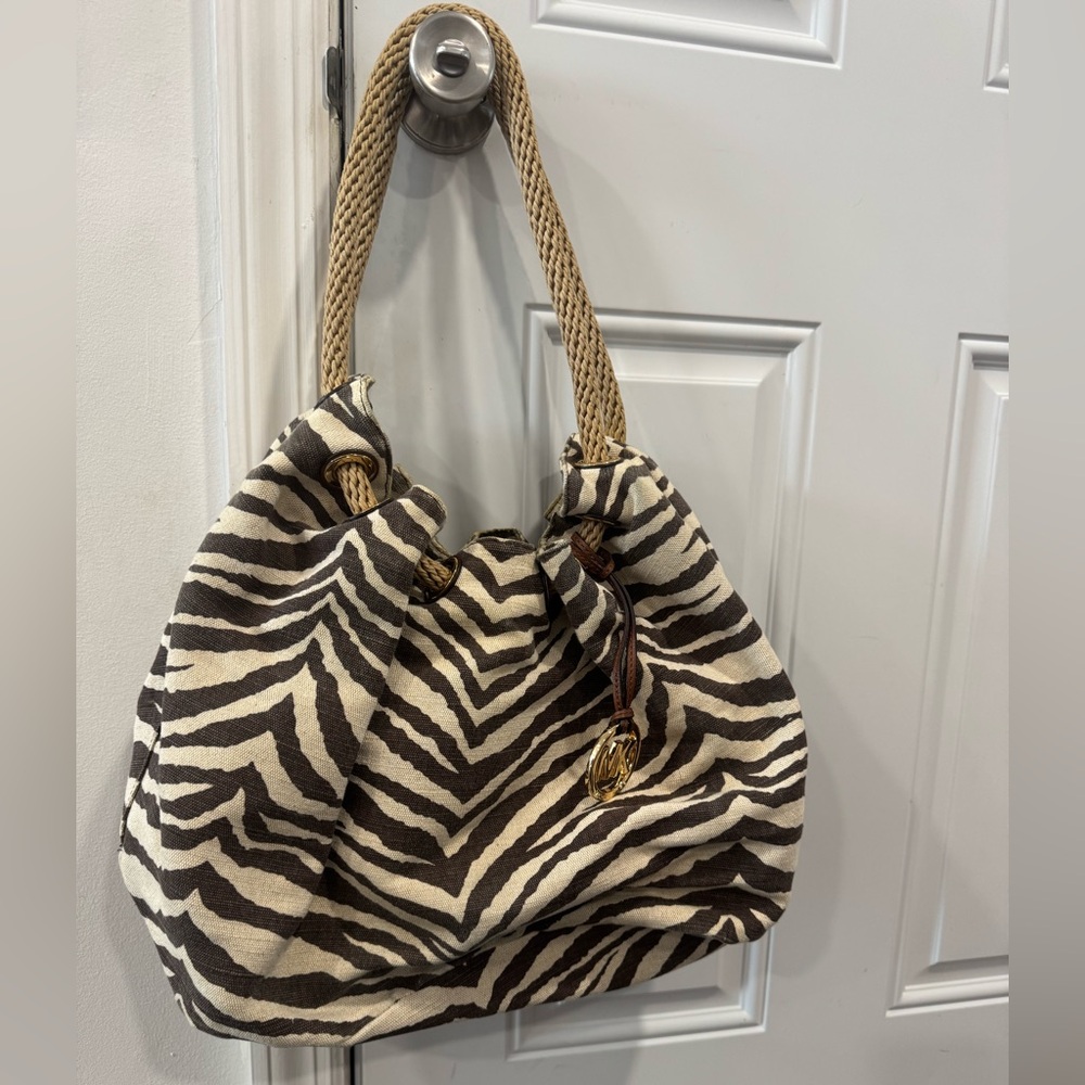 Like new, gently used Michael Kors canvas zebra print tote bag.